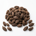 Whole Masala Elaichi (black cardamom) pods on a white background