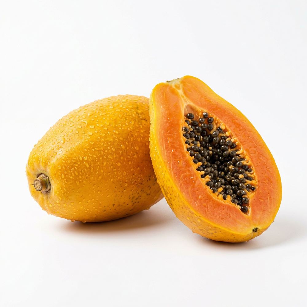 Fresh premium papaya whole and halved showing orange flesh on white background
