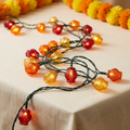 Illustrative Diwali LED string lights with colourful miniature lantern-shaped covers