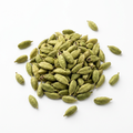 Whole green elaichi cardamom pods on a white background