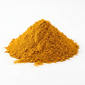 A mound of golden turmeric powder on a clean white background