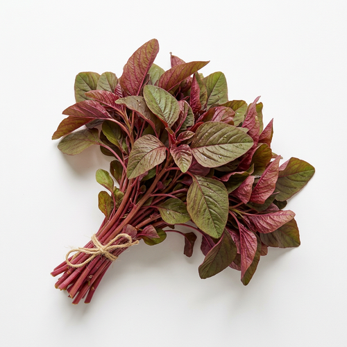 Red amaranthus leafy greens on a white background