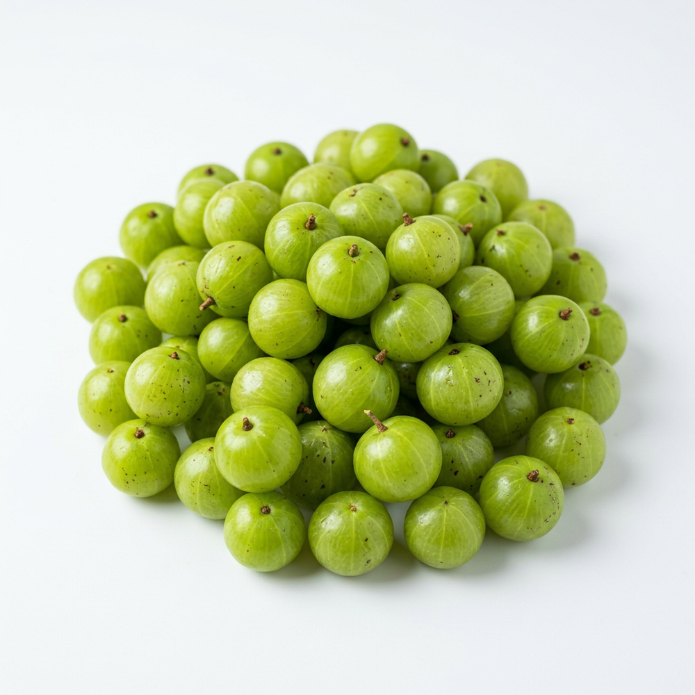 Fresh green Indian gooseberry amla fruits on white background