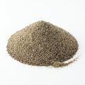 A mound of ground black pepper powder on a clean white background