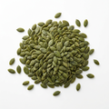 Green shelled pumpkin seeds on a white background